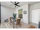 The screened patio has a ceiling fan, dining set, and a Gossman name plate at 14281 Heritage Landing Blvd # 1418, Punta Gorda, FL 33955