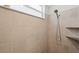 Shower room with custom tile, wall shower head, and built in wall shelves at 14281 Heritage Landing Blvd # 1418, Punta Gorda, FL 33955