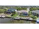 Beautiful home with a screened-in pool on the canal with a private boat dock at 15538 Aqua Cir, Port Charlotte, FL 33981