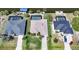 Real estate aerial view of single Gathering homes with private pools on the canal at 15538 Aqua Cir, Port Charlotte, FL 33981