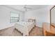 Bedroom features a plush bed with decorative pillows, and a full closet at 15538 Aqua Cir, Port Charlotte, FL 33981