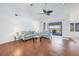 Bright living room with a sliding glass door leading to screened-in porch, complete with tile flooring at 15538 Aqua Cir, Port Charlotte, FL 33981