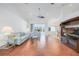 Spacious living room with tile flooring, bright lighting, and sliding glass doors to the pool at 15538 Aqua Cir, Port Charlotte, FL 33981