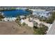 Aerial view showcasing the community amenities, including a pool, lake, and well-maintained landscaping at 2001 Bal Harbor Blvd # 2312, Punta Gorda, FL 33950