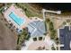 Aerial view of a community pool, clubhouse with parking, a dock and tropical landscaping at 2001 Bal Harbor Blvd # 2312, Punta Gorda, FL 33950