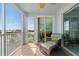 Screened balcony featuring comfortable seating and serene views of the surrounding community at 2001 Bal Harbor Blvd # 2312, Punta Gorda, FL 33950