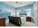 Bedroom with two windows and queen bed with coastal decor at 2001 Bal Harbor Blvd # 2312, Punta Gorda, FL 33950