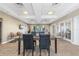 Spacious clubhouse interior with a large glass table, chairs and TV at 2001 Bal Harbor Blvd # 2312, Punta Gorda, FL 33950