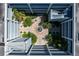 Aerial view of the courtyard with a fountain, landscaping, seating, and staircase access at 2001 Bal Harbor Blvd # 2312, Punta Gorda, FL 33950