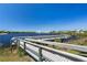 Wooden dock on the water, perfect for enjoying serene views and waterfront access at 2001 Bal Harbor Blvd # 2312, Punta Gorda, FL 33950