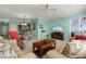 Open-concept living area with tile flooring, a ceiling fan, and a view of the balcony at 2001 Bal Harbor Blvd # 2312, Punta Gorda, FL 33950