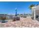 Community pool area featuring tables, umbrellas, and chairs for residents to relax and enjoy the view at 2001 Bal Harbor Blvd # 2312, Punta Gorda, FL 33950