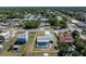 Aerial view of a charming single-Gathering home with a screened pool, fenced yard and established neighborhood at 21168 Quesada Ave, Port Charlotte, FL 33952
