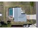 Aerial view of the house showcasing a screened-in pool, neutral roof, and spacious yard at 21168 Quesada Ave, Port Charlotte, FL 33952