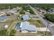 Overhead view of a lovely home featuring a screened pool, fenced backyard, convenient shed, and tranquil neighborhood at 21168 Quesada Ave, Port Charlotte, FL 33952