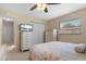 Bedroom with neutral wall paint, a ceiling fan, and a window with coverings at 21168 Quesada Ave, Port Charlotte, FL 33952