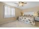 Cozy bedroom featuring neutral walls, carpet, and a queen-sized bed at 21168 Quesada Ave, Port Charlotte, FL 33952