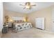 Cozy bedroom featuring neutral walls, carpet, and a queen-sized bed at 21168 Quesada Ave, Port Charlotte, FL 33952