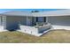Charming front yard featuring a sitting area and small garden with rock border at 21168 Quesada Ave, Port Charlotte, FL 33952