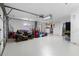 Garage features lawn equipment and a washer/dryer with white walls and door at 21168 Quesada Ave, Port Charlotte, FL 33952