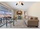 The home features an open living room area that looks out onto the pool through a sliding glass door at 21168 Quesada Ave, Port Charlotte, FL 33952