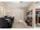 Bright office space with neutral paint, carpet, a desk area, and shelves at 21168 Quesada Ave, Port Charlotte, FL 33952