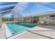 Enjoy the outdoor space with this screened pool, ideal for relaxation and entertainment at 21168 Quesada Ave, Port Charlotte, FL 33952