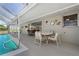 The poolside lanai offers a relaxing atmosphere for entertaining, with a view of the pool and outdoor area at 21168 Quesada Ave, Port Charlotte, FL 33952