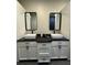 Bathroom featuring dual sinks, modern fixtures, and ample counter space at 22223 Seyburn Ter, Port Charlotte, FL 33954