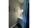 Cozy powder room with modern vanity, decorative mirror, and neutral color palette at 22223 Seyburn Ter, Port Charlotte, FL 33954
