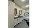 Elegant bathroom with double vessel sinks, sleek black hardware, and a modern soaking tub at 22223 Seyburn Ter, Port Charlotte, FL 33954