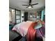 A bedroom featuring a large comfortable bed, stylish decor, and plenty of storage space at 22223 Seyburn Ter, Port Charlotte, FL 33954