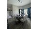 An elegant dining area with modern lighting, a spacious table, and seating for eight at 22223 Seyburn Ter, Port Charlotte, FL 33954