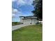 Two-story home with three-car garage and a paver driveway at 22223 Seyburn Ter, Port Charlotte, FL 33954