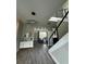 Grand foyer featuring wood floors, modern lighting, and staircase leading to a second level at 22223 Seyburn Ter, Port Charlotte, FL 33954