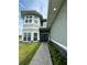 Inviting front entrance with stone accents, double doors, and manicured landscaping at 22223 Seyburn Ter, Port Charlotte, FL 33954