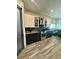 Modern kitchen with stainless steel appliances, two-toned cabinets, and stylish backsplash at 22223 Seyburn Ter, Port Charlotte, FL 33954