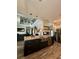 Spacious kitchen island with stainless steel sink, granite countertops, and pendant lighting at 22223 Seyburn Ter, Port Charlotte, FL 33954