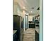 Modern kitchen featuring stainless steel appliances, granite countertops, and stylish tile flooring at 22223 Seyburn Ter, Port Charlotte, FL 33954