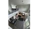 Open floorplan featuring a living area, a kitchen island, and a dining space with natural light at 22223 Seyburn Ter, Port Charlotte, FL 33954