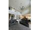 Great room with soaring ceilings, clerestory windows, and a view of the kitchen and loft at 22223 Seyburn Ter, Port Charlotte, FL 33954