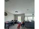 Open-concept living room with ample space for recreation and relaxation at 22223 Seyburn Ter, Port Charlotte, FL 33954
