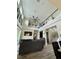 Open living area with a high ceiling, clerestory windows, and comfortable seating at 22223 Seyburn Ter, Port Charlotte, FL 33954