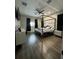 Bright, modern main bedroom with hardwood floors, ceiling fan, and canopy bed at 22223 Seyburn Ter, Port Charlotte, FL 33954