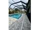 Long backyard pool with a screened enclosure at 22223 Seyburn Ter, Port Charlotte, FL 33954