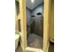 Walk-in shower features dual shower heads, mosaic tile and modern gray and black tiling at 22223 Seyburn Ter, Port Charlotte, FL 33954