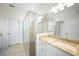 Lovely bathroom featuring bright vanity, glass enclosed shower, and natural light at 2232 Bonito Way, Port Charlotte, FL 33953