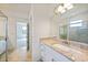 Bathroom with granite counters, tile floors, and a glass shower at 2232 Bonito Way, Port Charlotte, FL 33953