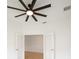 An inviting bedroom featuring french doors and a modern ceiling fan at 2232 Bonito Way, Port Charlotte, FL 33953