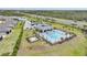 Aerial view of community pool, close to tennis courts, and close to shopping at 2232 Bonito Way, Port Charlotte, FL 33953